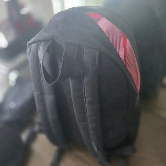Black Herschel Backpack with Red and White Striped Interior - Picture 3 of 5